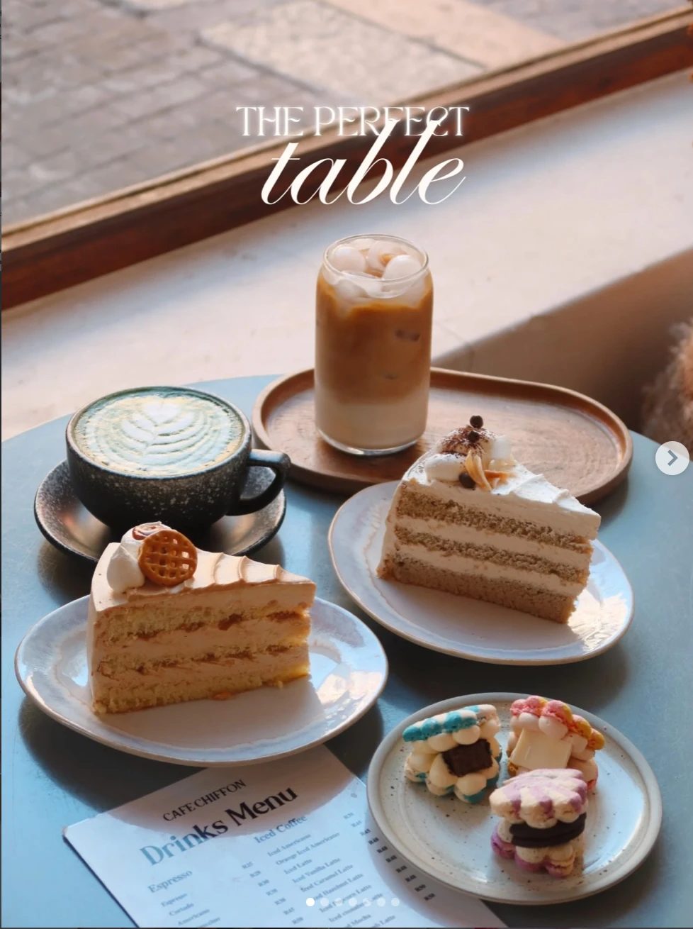 A Café Chiffon table with matcha latte, iced coffee, layer-cake slices and Korean macarons